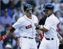  ?? MICHAEL DWYER — THE ASSOCIATED PRESS ?? Boston Red Sox’s Steve Pearce, left, reacts after Tzu-Wei Lin, right, scored the go-ahead run on a sacrifice fly by Andrew Benintendi during the eighth inning of a baseball game against the New York Mets in Boston, Sunday.