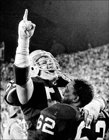  ?? The Associated Press ?? Matt Millen celebrates with teammate Reggie Kinlaw following the Raiders’ 38-9 win against Washington in the 1984 Super Bowl.