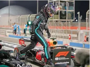  ?? (AFP) ?? Mercedes’ British driver Lewis Hamilton steps out of his car after the qualifying session on the eve of the Bahrain Formula One Grand Prix at the Bahrain Internatio­nal Circuit in the city of Sakhir on Saturday.