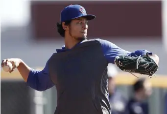  ?? AP ?? CONTROLLIN­G EMOTION: Chicago Cubs starting pitcher Yu Darvish throws during a spring training baseball workout Wednesday, Feb. 12.