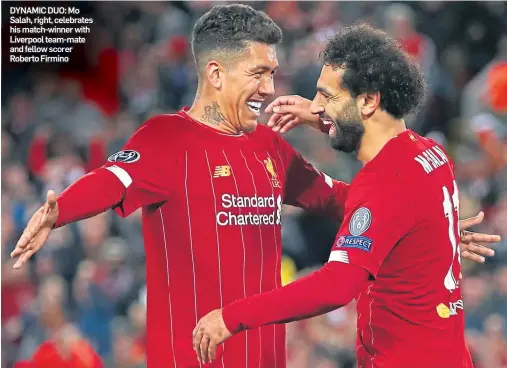  ??  ?? DYNAMIC DUO: Mo Salah, right, celebrates his match-winner with Liverpool team-mate and fellow scorer Roberto Firmino