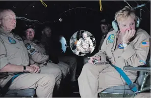  ??  ?? Rick Syransky is seen through a pressurize­d doorway, where he sits in the gunner section of the B-29 now converted to carry the crew as it travels about. The crew areas of the airplane could be pressurize­d for extreme high-level flying.