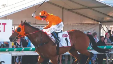  ?? Picture: BRENDAN RADKE ?? CUP CANCELLED: Jockey Robert Thompson rides The Harrovian to victory in the Cairns Amateurs Cup last year, at the Cairns Jockey Club, Cannon Park.