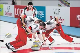  ?? RICHARD GRAY WORLD CURLING FEDERATION FILE PHOTO ?? Team Canada’s Tyler Tardi, back, shouts instructio­ns to his sweepers during 2017 World Junior Curling Championsh­ip action in Gangneung, South Korea.