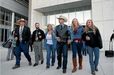  ?? PHOTO: AP ?? From left, Ammon Bundy, Ryan Payne, Robert Finicum’s widow Jeanette, and Ryan Bundy, wife Angela and daughter Jamie leave the courthouse in Las Vegas after a judge declared a mistrial in the case against the Bundy brothers, their father and Payne.