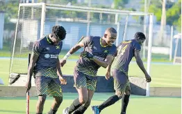  ?? KENYON HEMANS PHOTO ?? From left: Jamaica’s Nickoy Stephenson, Richard Harris, and Shemar Gordon celebrate one of the five goals they scored in a 5-2 win over Paraguay in Hockey 5s Pan American Cup third-place playoff game at the Mona Hockey Field in June of 2023. The victory sent Jamaica through the Hockey5s World Cup. Stephenson also scored in an 8-1 loss to the United States at the Hockey5s World Cup yesterday.