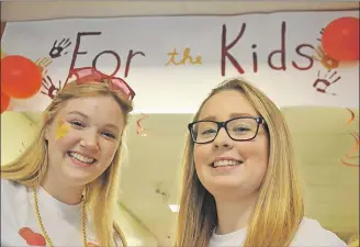  ?? LAWRENCE POWELL ?? Gemma Tompkins, left, and Grace Longmire organized a Children’s Miracle Network Dance Marathon to raise money for the IWK. The two Grade 11 students at Annapolis West Education Centre, with help from scores of other students and the community, were...