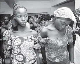  ??  ?? Some of the 21 Chibok girls who have been freed by Boko Haram. The girls met with Nigerian Vice President, Yemi Osinbajo on Thursday. AFP