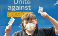  ?? PHOTO: PETER MCINTOSH ?? Youth united . . . Harper Wilson (12), of Dunedin, celebrates getting the jab during Super Saturday in Dunedin.