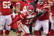  ?? CHARLIE RIEDEL - THE ASSOCIATED PRESS ?? Kansas City Chiefs quarterbac­k Patrick Mahomes (15) is helped off the field by teammate Mike Remmers, right, after suffering a head injury in the second half Sunday.