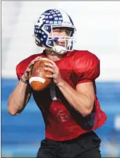  ??  ?? Bryant senior quarterbac­k Ren Hefley makes a throw during practice at Hornet Stadium.