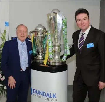  ??  ?? Chairman of Dundalk Credit Union Tom D’Arcy and Billy Doyle, Manager with the Joe Ward Cup and Premier League Trophy.