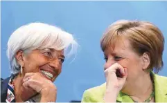  ?? MICHELE TANTUSSI AGENCE FRANCE-PRESSE ?? Christine Lagarde du FMI (à gauche) en compagnie de la chancelièr­e allemande, Angela Merkel, lundi à Berlin