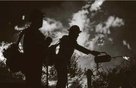  ?? Robert Gauthier / Los Angeles Times ?? In an undated photo, firefighte­rs in southern California battle the Bobcat Fire near the MountWilso­n Observator­y in Los Angeles County.