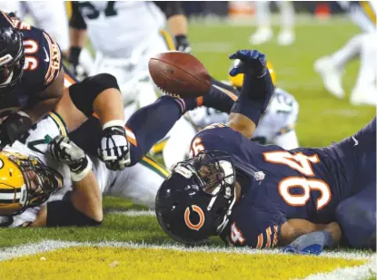  ??  ?? Bears rookie Leonard Floyd corrals a fumble in the end zone for a touchdown Oct. 20 against the Packers. | MATT LUDTKE/ AP