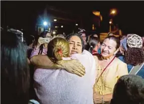  ?? EPA PIC ?? One of the released activists hugging a relative in Caracas on Saturday.