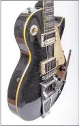  ??  ?? Chris Arena’s black 1959 Gibson Les Paul Standard, handed down from his grandfathe­r, has been appraised at hundreds of thousands of dollars in value.