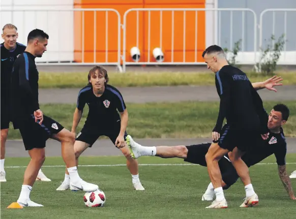  ?? Reuters ?? From left, Croatia’s Dejan Lovren, Luka Modric, Mario Mandzukic and other teammates take part in training at Novgorod yesterday