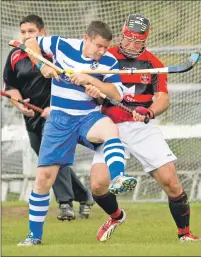 ?? Photograph: Neil Paterson. ?? Newtonmore’s Glen Mackintosh and Glenurquha­rt’s John Barr tussle for the ball during last Saturday’s MacTavish Cup semi final which Newtonmore won 3-1.