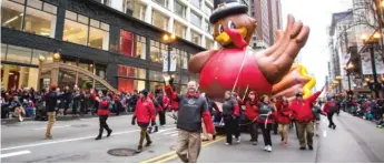  ?? SUN- TIMES FILE PHOTO ?? Well, one thing you won’t be able to do this year is join Teddy the Turkey in Chicago’s Thanksgivi­ng Parade, which is canceled this year.