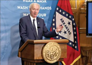  ?? (Arkansas Democrat-Gazette/Thomas Metthe) ?? Gov. Asa Hutchinson answers a question during a press conference announcing that the state’s current mask mandate will become a guideline on March 31 if certain public health goals are met on Friday, Feb. 26, at the state Capitol in Little Rock.