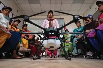  ?? — AFP photos by Sajjad Hussain ?? Women aspiring to be remote pilots attending a class under the government-backed ‘Drone Sister’ programme, at Drone Destinatio­n training centre in Manesar.