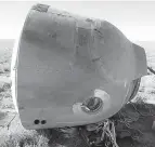  ?? Russian Defense Ministry Press Service photo ?? ■ The Soyuz MS-10 space capsule lies in a field after an emergency landing Thursday near Dzhezkazga­n, about 280 miles northeast of Baikonur, Kazakhstan.