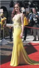  ??  ?? BUSTING OUT. The DA’s Terri Stander in a glitzy yellow gown.