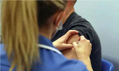  ??  ?? A patient receiving a Covid-19 vaccine. Latest figures report 7% of adults in Great Britain being hesitant about having a vaccinatio­n. Photograph: Steve Parsons/PA