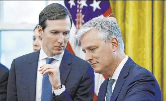  ?? Patrick Semansky The Associated Press file ?? Senior adviser Jared Kushner, left, talks with national security adviser Robert O’Brien as President Donald Trump speaks at a news conference Nov. 13. Kushner said O’Brien, thrust into the spotlight by the Iran crisis, “is a deal guy” who’s unafraid to take action.
