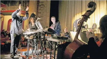  ?? Marcus Yam Los Angeles Times ?? NICHOLAS BRITELL, center, is shown last month at a live orchestra performanc­e and “Moonlight” screening in downtown L.A.