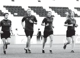  ??  ?? Assistant referee Michelle O’Neill of Ireland, fourth official Cuneyt Cakir of Turkey, main referee Stephanie Frappart of France and assistant referee Manuela Nicolosi of France, from left, run during a training session ahead of UEFA Super Cup at the Besiktas Park in Istanbul, Turkey, Tuesday, Aug. 13, 2019. Frappart will make history by becoming the first female to officiate in a major men’s European match on Wednesday when she and her team will officiate the UEFA Super Cup soccer match between Liverpool and Chelsea will be played at Besiktas Park on Wednesday, August 14.