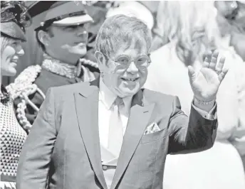  ?? El cantante y compositor Elton John no podía faltar al evento. AFP Y EFE ??