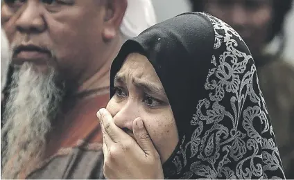  ?? Picture:EPA ?? HORROR. A relative of a teenage student cries after a fire broke out at a religious school in Jalan Datuk Keramat, Kuala Lumpur, Malaysia, yesterday.