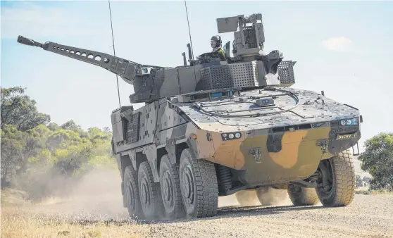  ?? VEHICLE WAR: A Rheinmetal­l Boxer CRV drives off a training area at Puckapunya­l Range in Victoria, Picture: CPL SEBASTIAN BEURICH/ DEFENCE DEPARTMENT ??