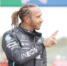  ?? — Reuters ?? Mercedes’ Lewis Hamilton celebrates after qualifying in pole position at Emilia Romagna Grand Prix in Imola, Italy.