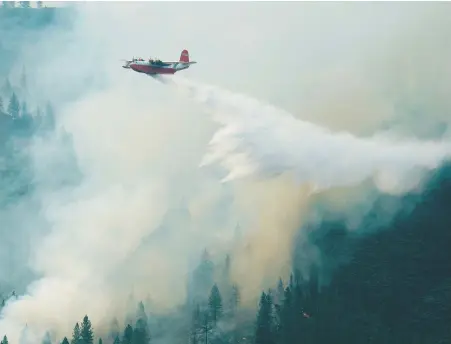  ?? COULSON GROUP ?? Hawaii Martin Mars fights a forest fire in northern California, near Shasta Lake, in July 2008. The water bomber will make one last flight from Sproat Lake to North Saanich as it retires.