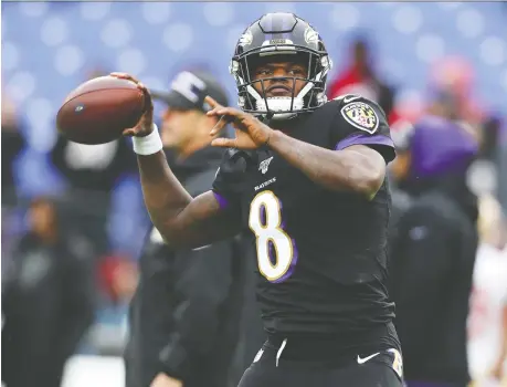  ?? ROB CARR/GETTY IMAGES ?? In quarterbac­k Lamar Jackson’s first full season as a starter, the Baltimore Ravens have outscored their opponents by 187 points while averaging a league-best 207.8 rushing yards. They have gone from an average team to boasting the NFL’S best record at 10-2.