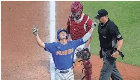  ?? CYNDI CHAMBERS/SPECIAL TO THE GAINESVILL­E SUN ?? Florida's outfielder Jud Fabian celebrates after his home runs against Oklahoma on Sunday in Gainesvill­e, Fla.