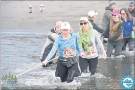  ??  ?? Crossing of the river on the Trinidad to Clam Beach Run in 2019. “This is such a beautiful run that I come back to most years, due to its variety of rolling hills, river crossing, ending with a two-mile beach run and bonfire. There is a group from Ukiah who take over a B&B for the weekend that has provided years of fond memories. I had a big win the year I
turned 50 – won the overall Masters females and fourth female overall,” Stewart says.