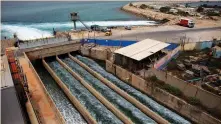  ?? (Nir Elias/Reuters) ?? BRINE WATER flows into the Mediterran­ean Sea after passing through a desalinati­on plant in the coastal city of Hadera in 2010.