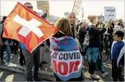  ?? SALVATORE DI NOLFI / KEYSTONE ?? Protesters gather for a demonstrat­ion march against civil restrictio­ns and the COVID-19 vaccine, in Geneva, Switzerlan­d, on Oct. 9.