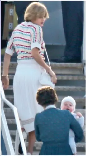  ??  ?? HEIR MILES: Emma Corrin as Diana boards a jet with ‘William’ and a nanny