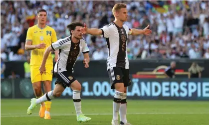  ?? ?? Joshua Kimmich celebrates scoring Germany’s equaliser against Ukraine. Photograph: Friedemann Vogel/EPA