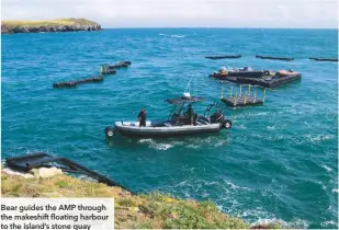  ??  ?? Bear guides the AMP through the makeshift floating harbour to the island’s stone quay