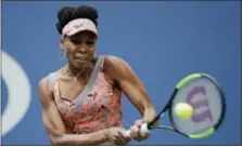  ?? SETH WENIG — THE ASSOCIATED PRESS ?? Venus Williams returns a shot from Viktoria Kuzmova during the first round of the U.S. Open tennis tournament Monday. Williams won in three sets.