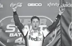  ??  ?? Denny Hamlin celebrates his NASCAR Cup Series fifth victory of 2020 on July 23 at Kansas Speedway.