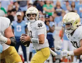  ?? Chris Seward/Associated Press ?? Quarterbac­k Drew Pyne, a New Canaan native, has been selected as Walter Camp’s 2022 Connecticu­t Player of the Year, presented by The Outlier Project.