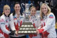  ?? THE CANADIAN PRESS/PAUL CHIASSON ?? Canada lead Dawn McEwen, second Jill Officer, third Kaitlyn Lawes, skip Jennifer Jones, left to right, hold up the trophy after the gold medal final game win over Sweden at the World Women's Curling Championsh­ip Sunday in North Bay, Ont.