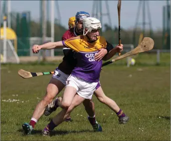  ??  ?? Conal Crowley of Faythe Harriers comes up against Owen O’Leary of St Martin’s.